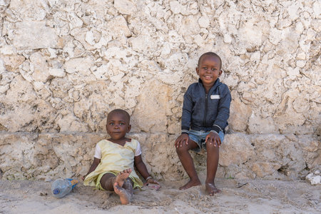 Zanzibar, Tanzania - november 11, 2019 : Unknown african young children on a street of Zanzibar island, Tanzania, East Africaのeditorial素材