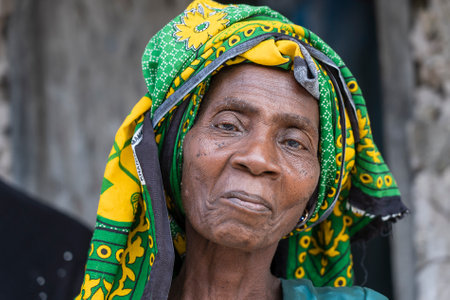 Zanzibar, Tanzania - december 09, 2019 : African old woman on the street near home of Zanzibar island, Tanzania, East Africa, close upのeditorial素材