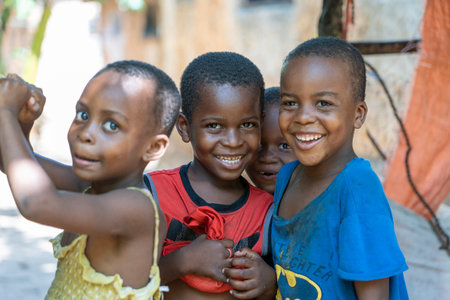 Zanzibar, Tanzania - november 16, 2019 : Unknown african young children on a street of Zanzibar island, Tanzania, East Africaのeditorial素材