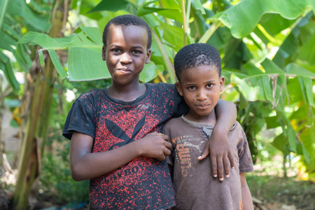 Zanzibar, Tanzania - november 16, 2019 : Unknown african two young boys on a street of Zanzibar island, Tanzania, East Africa, close upのeditorial素材