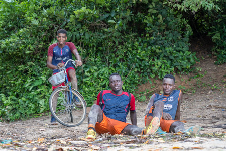Zanzibar, Tanzania - november 16, 2019 : Unknown three african young guys on the beach of Zanzibar island, Tanzania, East Africa, close upのeditorial素材