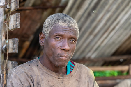 Zanzibar, Tanzania - november 22, 2019 : African old man on the street near home of Zanzibar island, Tanzania, East Africa, close upのeditorial素材