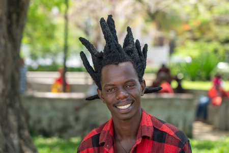Zanzibar, Tanzania - november 03, 2019 : African guy rest on the promenade in Stone Town on the...