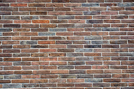 Weathered of old vintage brick wall background and texture, close upの写真素材