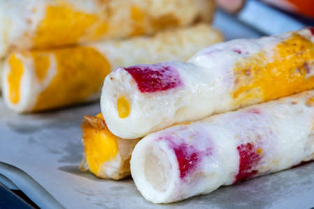 Rolled omelet together with seafood for sale at the street food market in island Koh Phangan, Thailand. Close upの写真素材