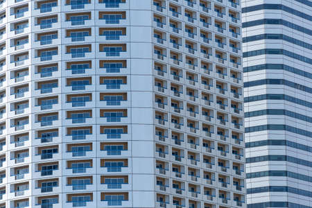 High skyscrapers on the streets. Office windows background, close up