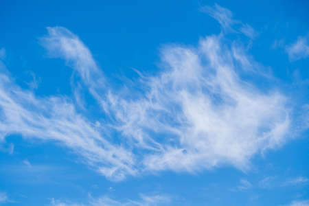 White fluffy clouds in the blue sky, abstract background