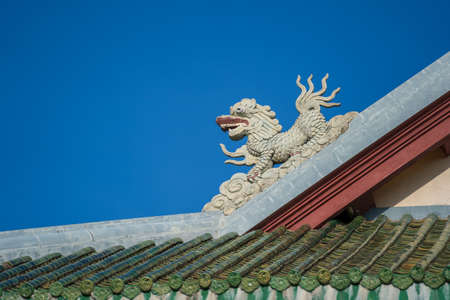Colorful dragon sculpture on the roof In a Buddhist temple in Danang, Vietnam. Close upの写真素材