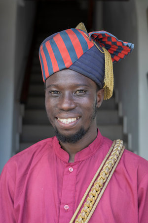 Zanzibar, Tanzania - november 14, 2019: African man dressed in national clothes on a street in Stone Town on the island of Zanzibar, Tanzania, East Africaのeditorial素材