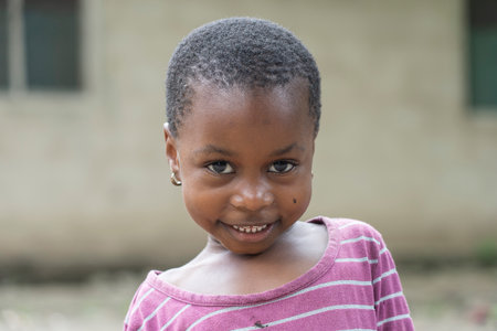 Zanzibar, Tanzania - october 30, 2019: Unknown african young girl on a street of Zanzibar island, Tanzania, East Africa, close upのeditorial素材