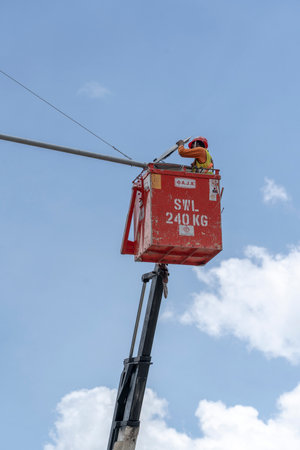 Singapore city, Singapore - February 28, 2020: A migrant worker on a city center construction site in Singapore. The SE Asian city state has a significant migrant worker populationのeditorial素材