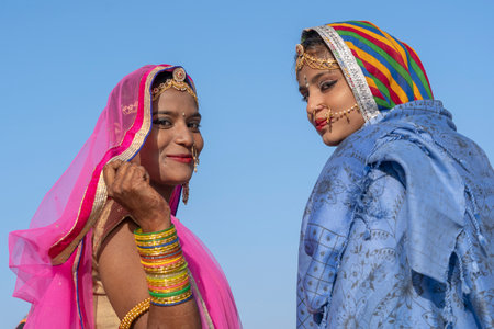 PUSHKAR, INDIA - NOVEMBER 16, 2018: Indian young girl in the desert Thar on time Pushkar Camel Mela...