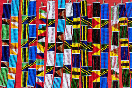 Tribal masai colorful bracelets for sale for tourists at the beach market, close up. Island of Zanzibar, Tanzania, East Africaの写真素材