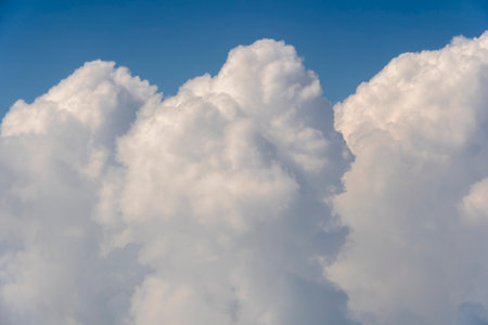 White clouds and blue sky, a view from airplane window. Nature background