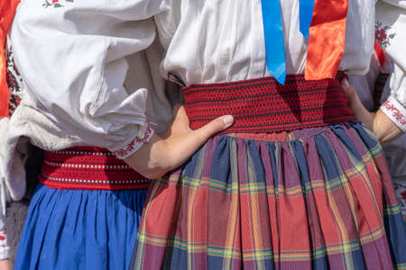 Colorful clothes on at young girls during a festival in Ukraine. Close up