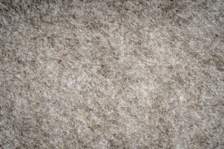 Gray heather knitted fabric made of synthetic fibers textured background. Gray knitted fabric texture. Background with delicate striped pattern, close upの写真素材