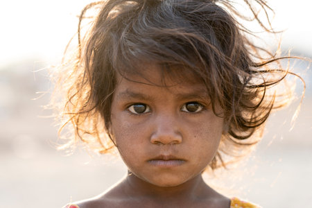 PUSHKAR, INDIA - NOVEMBER 14, 2018: Indian young girl in the desert Thar on time Pushkar Camel Mela near holy city Pushkar, Rajasthan, India, close up portraitのeditorial素材