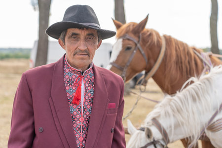 Slavuta, Ukraine - September 22, 2019: Ukrainian man and horse participate in the Ethno-eco festival Kolodar in city Slavuta, Ukraineのeditorial素材