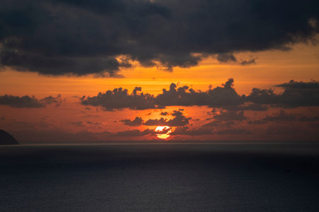 Landscape sunrise on Hon Chong cape, Nha Trang, Khanh Hoa Province, Vietnam. Travel and nature concept. Morning sky, clouds, sun and sea waterの写真素材