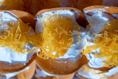 Delicious Thai street dessert, Kanom Buang, Thai Crispy Pancake or Thai Crepe, with varieties of...