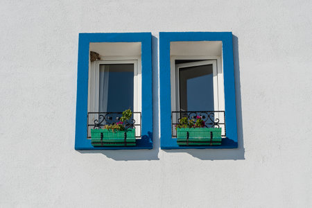 Two windows with flower pots on white wall in Bodrum, Turkey, copy spaceの写真素材