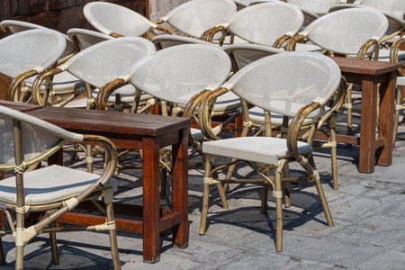 Empty table and chairs in restaurant on the beach, Kos island, Greece. Beach cafe near sea, outdoors. Travel and vacation conceptの写真素材
