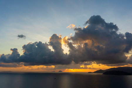 Landscape sunrise on Hon Chong cape, Nha Trang, Khanh Hoa Province, Vietnam. Travel and nature concept. Morning sky, clouds, sun and sea waterの写真素材