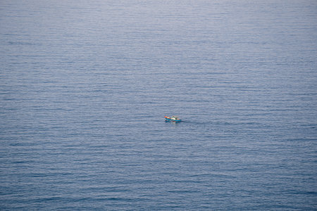 Aerial view of a fishing boat on sea water near town of Da Nang, Vietnamの写真素材