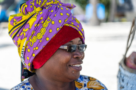 Zanzibar, Tanzania - january 07, 2020: African woman on the street market of Zanzibar island, Tanzania, East Africa, close upのeditorial素材