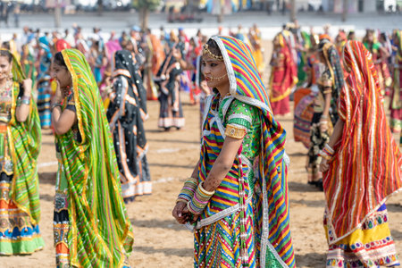 PUSHKAR, INDIA - NOVEMBER 16, 2018: Indian young girl in the desert Thar on time Pushkar Camel Mela near holy city Pushkar, Rajasthan, India, close up portraitのeditorial素材