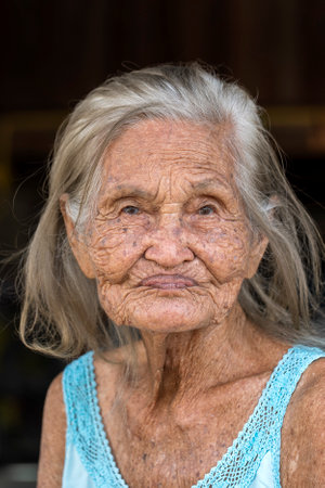 KOH PHANGAN, THAILAND - FEBRUARY 02, 2019: Portrait old woman on street market in island Koh Phangan, Thailand, close upのeditorial素材