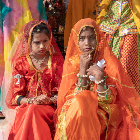 PUSHKAR, INDIA - NOVEMBER 16, 2018: Indian young girl in the desert Thar on time Pushkar Camel Mela near holy city Pushkar, Rajasthan, India, close up portraitのeditorial素材