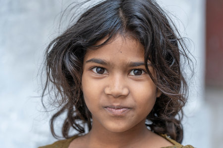 UDAIPUR, INDIA - NOVEMBER 21, 2018: Indian young girl on street market in Udaipur, Rajasthan, India,...
