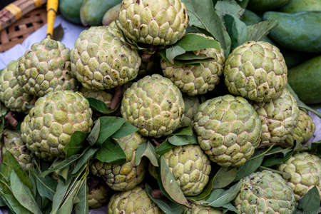 Sugar apple for sale at street food market in the old town of Hanoi, Vietnam. Close upの写真素材