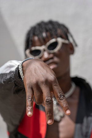 Zanzibar, Tanzania - november 14, 2019: African cool guy dancing on the street in Stone Town on the...