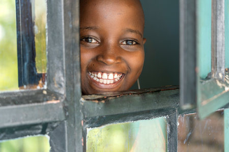 Arusha, Tanzania - December 20, 2019: Unidentified african girl in a local school in Arusha, Tanzania, East Africa, close upのeditorial素材