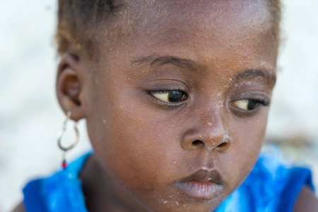 Zanzibar, Tanzania - january 11, 2020: Young African girl on the tropical beach in island of Zanzibar, Tanzania, east Africa, close upのeditorial素材