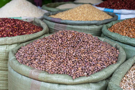 Assortment of dry beans in for sale at a local street food market on the island of Zanzibar,...