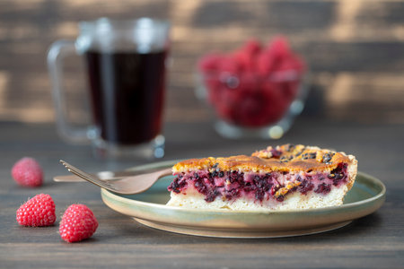 Homemade organic blackberry pie dessert ready to eat. Blackberry tart on the old wooden background, close up. Beautiful organic fresh fruit tart with gluten free crustの写真素材