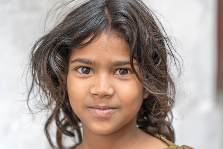UDAIPUR, INDIA - NOVEMBER 21, 2018: Indian young girl on street market in Udaipur, Rajasthan, India, close up portraitのeditorial素材