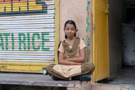 PUSHKAR, INDIA - NOVEMBER 15, 2018: Unidentified handsome Indian schoolgirl with uniform on the street. Pushkar, Rajasthan, Indiaのeditorial素材