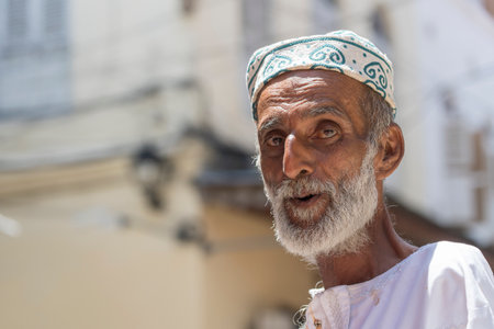 Zanzibar, Tanzania - november 25, 2019: African old man on the street in Stone Town on the island of Zanzibar, Tanzania, east Africa, close upのeditorial素材