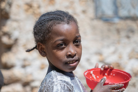 Zanzibar, Tanzania - november 16, 2019: Unknown african young girl on a street of Zanzibar island, Tanzania, East Africa, close upのeditorial素材