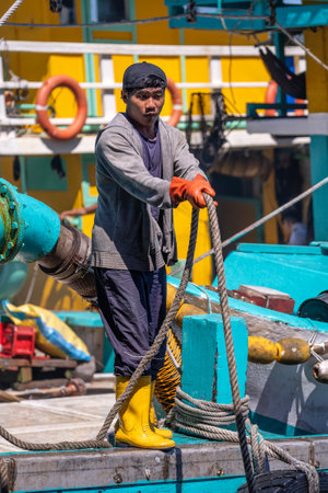 Kota Kinabalu, Malaysia - February 25, 2020: Portrait of a Malaysian male worker on the fishing boat in Kota Kinabalu, Sabah, Malaysiaのeditorial素材
