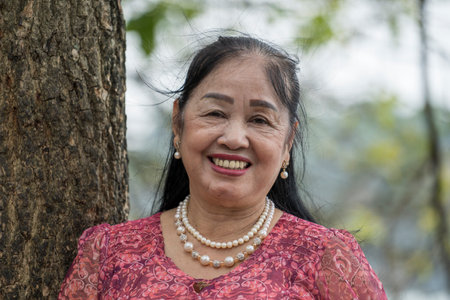 Hanoi, Vietnam - march 01, 2020: Beautiful Vietnamese old woman on the street in the old town of...