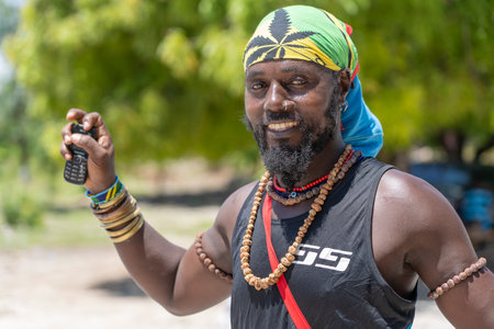 Zanzibar, Tanzania - December 12, 2019: African joyful man at a local street market on the island of Zanzibar, Tanzania, east Africa, close upのeditorial素材