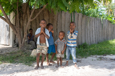 Zanzibar, Tanzania - january 04, 2020: Unknown african young happy boys on a street of Zanzibar island, Tanzania, East Africa, close up