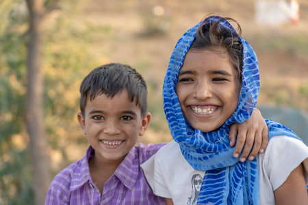 PUSHKAR, INDIA - NOVEMBER 13, 2018: Indian children in the desert Thar on time Pushkar Camel Mela near holy city Pushkar, Rajasthan, Indiaのeditorial素材