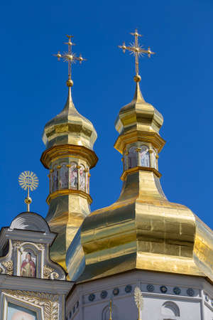 Beautiful domes of Christian Church on blue sky background, Kyiv, Ukraineの写真素材