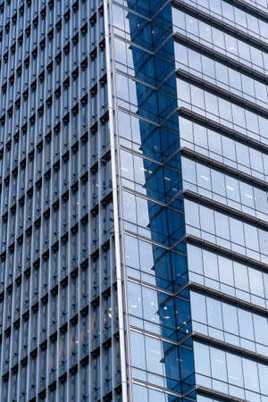 High glass skyscrapers on the streets of Singapore. Office windows background, close upの写真素材